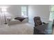 Bright bedroom with plush carpet, natural light, a daybed, and space for a study desk at 3008 Heathcroft Ct, Charlotte, NC 28269