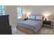 Cozy bedroom with neutral decor, a queen-sized bed and matching nightstands at 3008 Heathcroft Ct, Charlotte, NC 28269