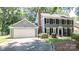 Charming two-story home with a well-manicured lawn and a two car garage, perfect for families at 3008 Heathcroft Ct, Charlotte, NC 28269