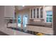 Bright kitchen with white cabinets, stainless steel appliances, and view to the outdoors at 3008 Heathcroft Ct, Charlotte, NC 28269