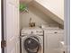 Functional laundry room with a front load washer and dryer at 3008 Heathcroft Ct, Charlotte, NC 28269