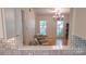 Open living space with a view from the kitchen featuring hardwood floors and natural light at 3008 Heathcroft Ct, Charlotte, NC 28269