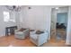 Comfortable living room with chairs and a view into the adjacent kitchen and entryway at 3008 Heathcroft Ct, Charlotte, NC 28269