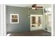 This screened porch with gray siding and wood flooring provides a tranquil outdoor space at 3008 Heathcroft Ct, Charlotte, NC 28269