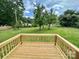 Back deck with wood railings and a view of the yard at 307 W Sunset Dr, Moore, NC 28110