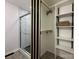 Modern bathroom with a glass-enclosed shower, open closet, and sleek design at 307 W Sunset Dr, Moore, NC 28110