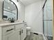 Modern bathroom showcasing a vanity with countertop, a glass enclosed shower, and tiled floors at 307 W Sunset Dr, Moore, NC 28110