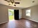 Bedroom with wood-look flooring and natural lighting at 307 W Sunset Dr, Moore, NC 28110