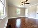 Bedroom with hardwood floors, neutral walls, and a ceiling fan at 307 W Sunset Dr, Moore, NC 28110
