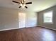 Bedroom featuring wood-look flooring, ceiling fan, and ample natural light at 307 W Sunset Dr, Moore, NC 28110