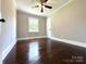 Bedroom featuring hardwood floors, neutral walls, ceiling fan, and natural light at 307 W Sunset Dr, Moore, NC 28110