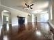Living room boasting hardwood floors, decorative fireplace, and open archways at 307 W Sunset Dr, Moore, NC 28110