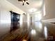Bright living room featuring hardwood floors, fireplace, and neutral wall color at 307 W Sunset Dr, Moore, NC 28110