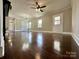 Large, inviting living area with hardwood floors and multiple access points at 307 W Sunset Dr, Moore, NC 28110