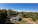 Aerial view of a single-story home nestled on a large lot with mature trees and greenery at 3330 Clinzo Feemster Rd, Hickory Grove, SC 29717