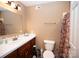 A well lit bathroom features a single sink vanity with white countertop, toilet, and shower at 3330 Clinzo Feemster Rd, Hickory Grove, SC 29717