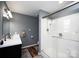 Modern bathroom features a glass door shower, wood look floors, and bright lighting at 3330 Clinzo Feemster Rd, Hickory Grove, SC 29717