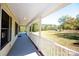 Covered front porch is perfect for relaxing and enjoying the views of the yard at 3330 Clinzo Feemster Rd, Hickory Grove, SC 29717