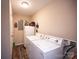 Neutral laundry room featuring side-by-side washer and dryer and storage space near the back door at 3330 Clinzo Feemster Rd, Hickory Grove, SC 29717