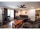 Cozy living room featuring hardwood floors, ceiling fan, and comfortable seating for relaxation and entertainment at 3330 Clinzo Feemster Rd, Hickory Grove, SC 29717
