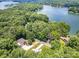 Stunning aerial view of a lakeside community surrounded by lush greenery and sparkling waters at 345 Beaten Path Rd, Mooresville, NC 28117