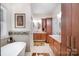 Luxurious bathroom features a freestanding tub, double vanities, and modern fixtures at 345 Beaten Path Rd, Mooresville, NC 28117