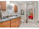 Bathroom with wood vanity, granite countertop, vessel sink, modern fixtures, tile floor, and walk-in shower at 345 Beaten Path Rd, Mooresville, NC 28117