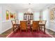 Formal dining room features hardwood floors, bright windows, and elegant chandelier at 345 Beaten Path Rd, Mooresville, NC 28117