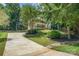 Beautiful two-story home featuring a welcoming front porch, lush landscaping, and a well-maintained driveway at 345 Beaten Path Rd, Mooresville, NC 28117