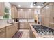 Modern kitchen boasts stainless steel appliances, granite countertops, and custom cabinetry at 345 Beaten Path Rd, Mooresville, NC 28117