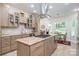 Spacious kitchen with center island, stainless hood, eat-in area, and plenty of natural light at 345 Beaten Path Rd, Mooresville, NC 28117