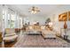 Bright living room features large windows, plush seating, area rug, and contemporary decor at 345 Beaten Path Rd, Mooresville, NC 28117