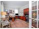 Well-lit office with built-in shelves, a large desk, plush rug, and comfortable seating at 345 Beaten Path Rd, Mooresville, NC 28117