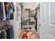 Organized walk-in closet featuring custom shelving, built-in drawers, and ample storage space for clothes and shoes at 345 Beaten Path Rd, Mooresville, NC 28117