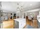 Open concept kitchen with a large island, stainless steel appliances, and hardwood floors at 3504 Mountainbrook Rd, Charlotte, NC 28210