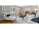 Bright living room with large windows, hardwood floors, and elegant furnishings at 3504 Mountainbrook Rd, Charlotte, NC 28210