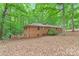 Brick two-story home featuring lush green foliage and privacy at 3985 Well Rd, Mint Hill, NC 28227