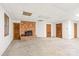 Large basement area with brick fireplace, and access to storage and utilities at 3985 Well Rd, Mint Hill, NC 28227