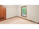Cozy bedroom with neutral carpet, trim and large window, creating a bright and airy space at 3985 Well Rd, Mint Hill, NC 28227