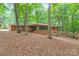 Beautiful brick home with lush foliage, mature trees, and a well-manicured landscape at 3985 Well Rd, Mint Hill, NC 28227
