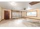 Attached garage with door and window, providing parking and workspace at 3985 Well Rd, Mint Hill, NC 28227