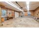 Spacious garage featuring wood paneling, ample lighting, and work benches provides ample space for vehicles and projects at 3985 Well Rd, Mint Hill, NC 28227