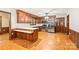 Charming kitchen featuring wood cabinetry, stainless steel appliances, and a breakfast bar, ready for culinary adventures at 3985 Well Rd, Mint Hill, NC 28227