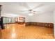 Open-concept living room with fireplace, sunroom, and adjacent kitchen, ideal for entertaining and everyday living at 3985 Well Rd, Mint Hill, NC 28227