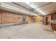 Large workshop with wood paneling, windows, and plenty of room for projects at 3985 Well Rd, Mint Hill, NC 28227