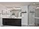 Modern bathroom showcasing a double vanity, sleek fixtures, and a spacious glass-enclosed shower at 402 Belton St, Charlotte, NC 28209