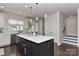 Spacious kitchen island with pendant lighting, white countertops, and stainless dishwasher at 402 Belton St, Charlotte, NC 28209