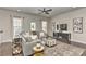 Inviting living room with a sectional sofa, decorative accents, and a large TV for entertainment at 402 Belton St, Charlotte, NC 28209