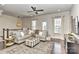 Comfortable living room with a large sectional sofa, stylish ottoman, and windows providing natural light at 402 Belton St, Charlotte, NC 28209