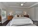 Bright main bedroom features a tray ceiling, ample natural light, and is adorned with stylish furnishings at 402 Belton St, Charlotte, NC 28209